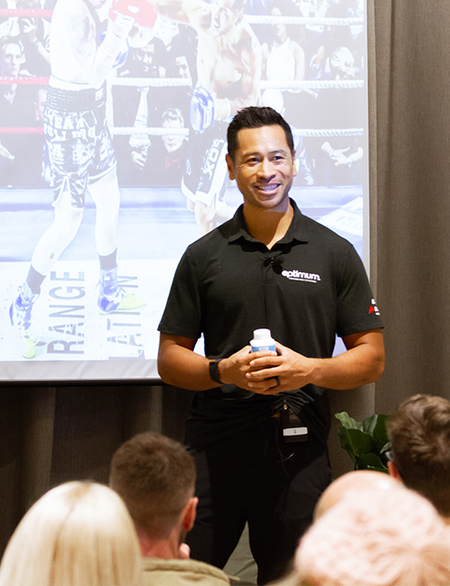 Reuben Aiono presenting to a seated audience